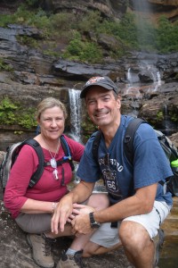 The brave mountain explorers pause at the base of  the tall and dramatic Wentworth Falls