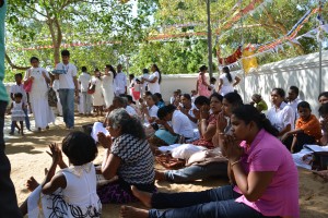 Locals gather under the long welcoming branches of this ancient Bodhi tree for their prayers