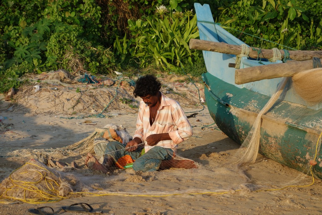 Another fisherman doing what he does every afternoon to prepare for another day of fishing