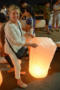 Julie getting ready to launch our lantern - mixing fire, traffic, thick crowds and firecrackers