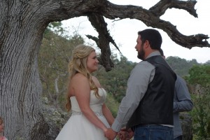 The beautiful young couple of Bryn and Bryan - yes, that's right - saying their vows under an old oak tree