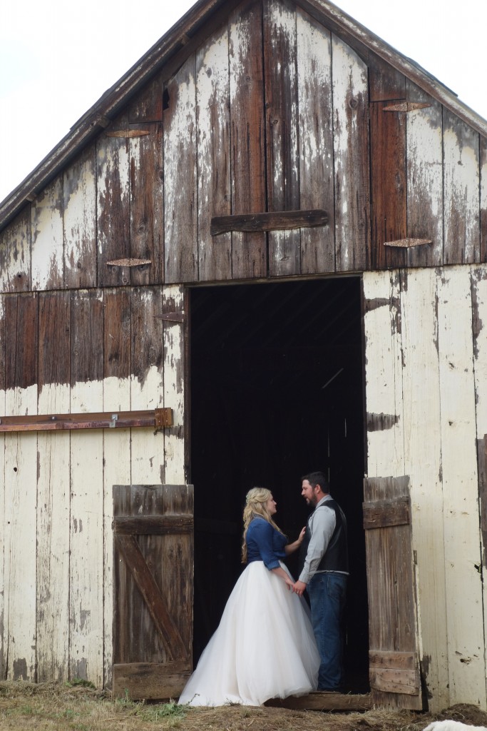 The happy young couple standing at the threshold of their new life together