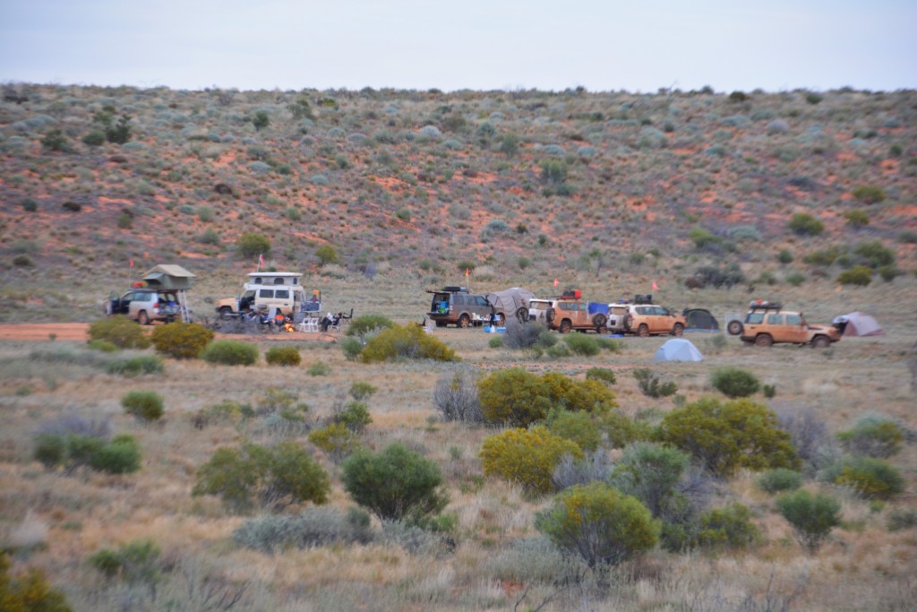 Camp for the night at the base of a large dune