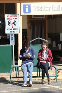 Tom and Annie park themselves under an important sign to connect with the outside world