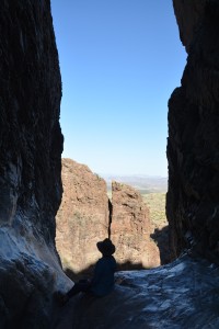 Julie silhouetted in the Window where water rushes over the precipice