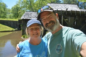 Two happy travellers in front of a 130 year old mill on the Blue Ridge Parkway