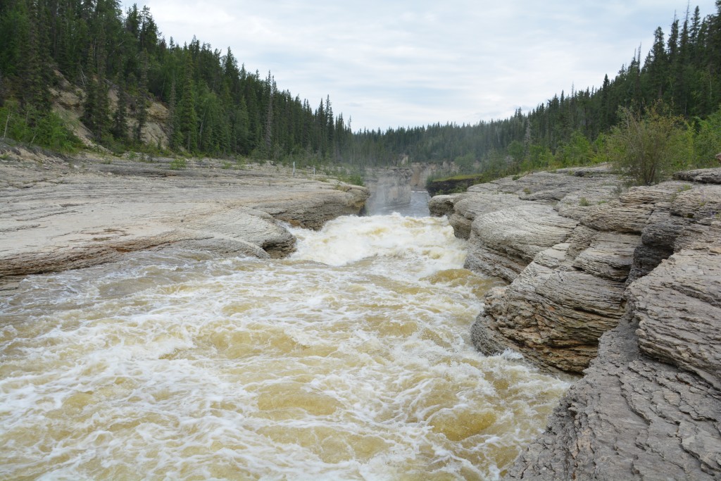 The Trout River shooting through a narrow gorge below our bridge