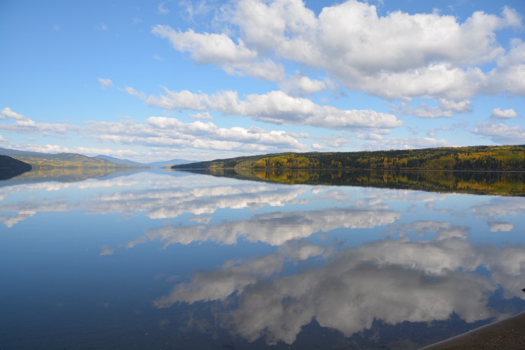 A perfect reflection of the land and clouds in this still lake